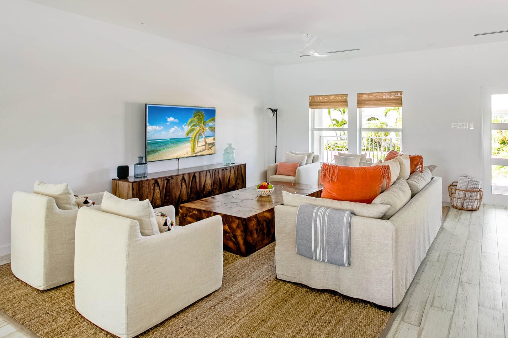 Living area with plush sofa furniture and HD television.