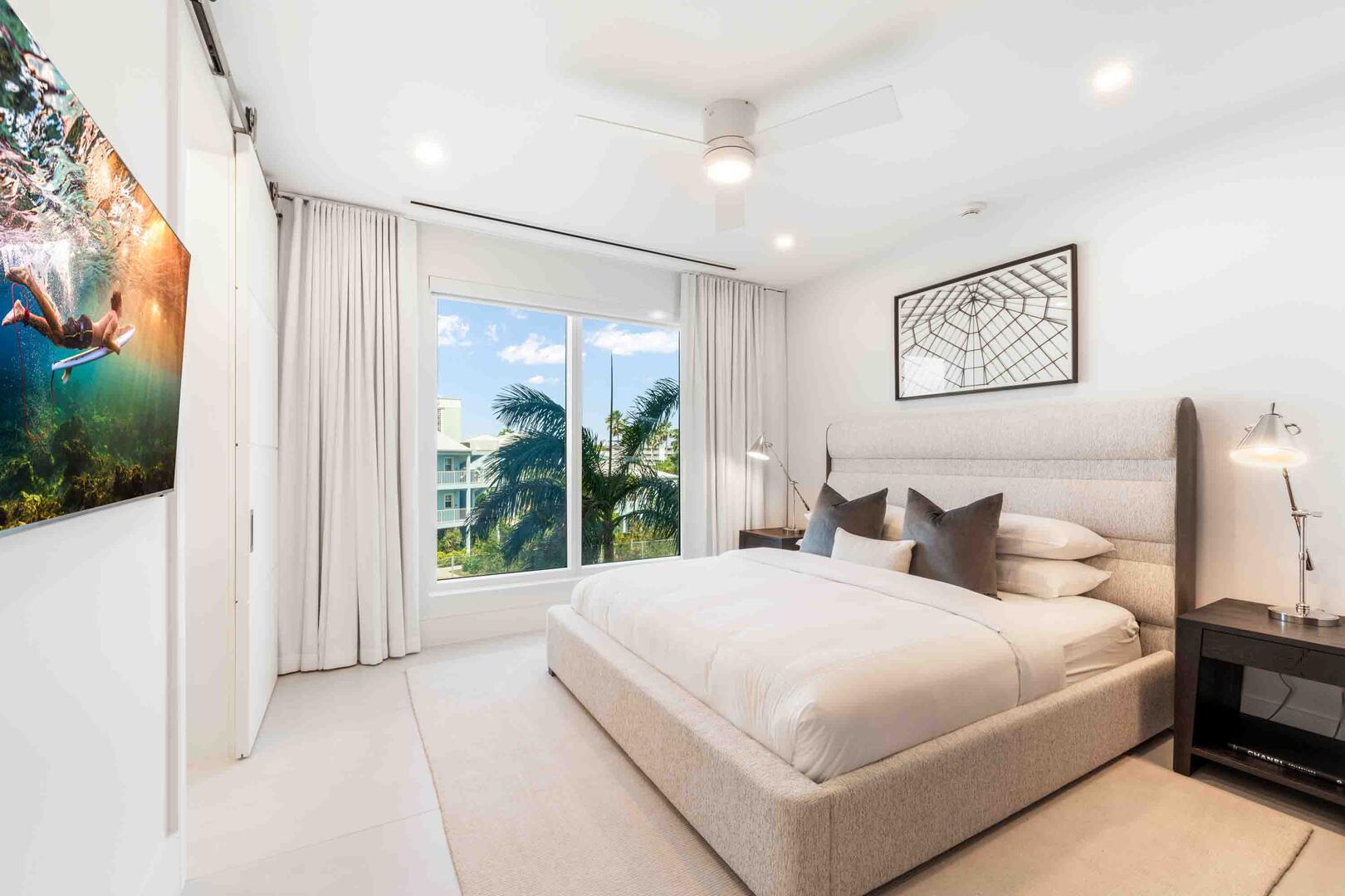 Bedroom 2 comes furnished with a king bed and SmartTV.