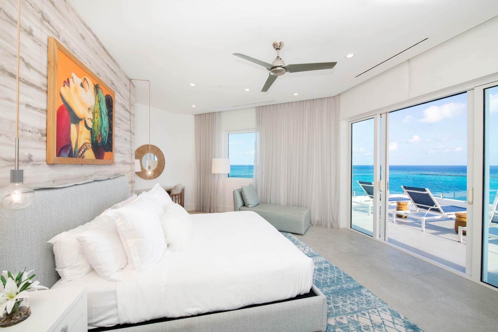 Primary Suite #1 with oceanfront views and walkout access to the balcony.