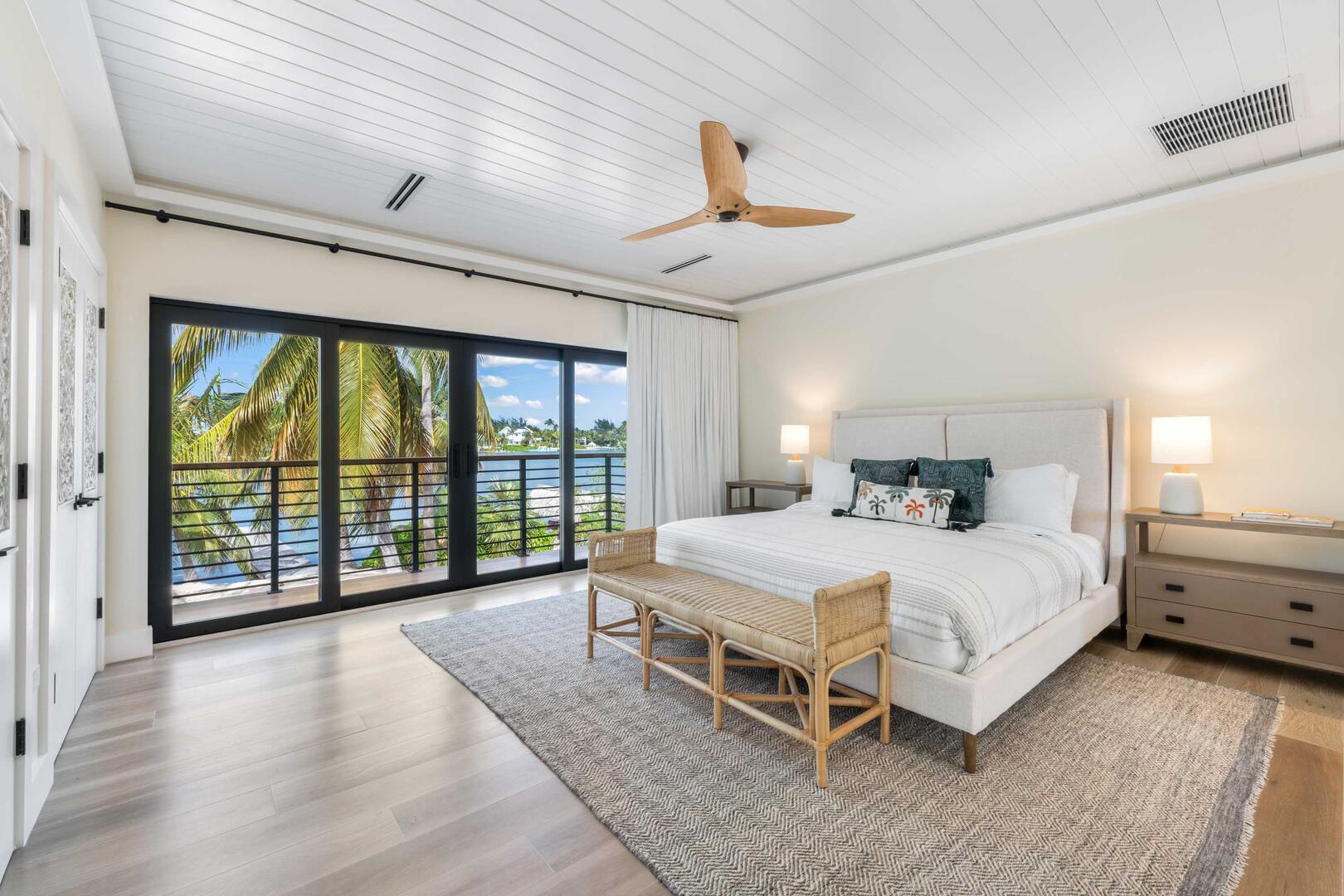 Bedroom 2 also features a walkout balcony providing elevated waterfront views.