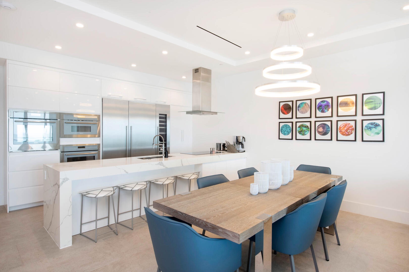 Dining table with seating for 6. The kitchen island provides additional seating.