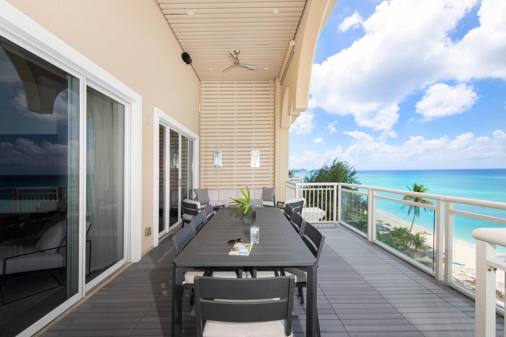 Alfresco dining table for meals with beachfront views.