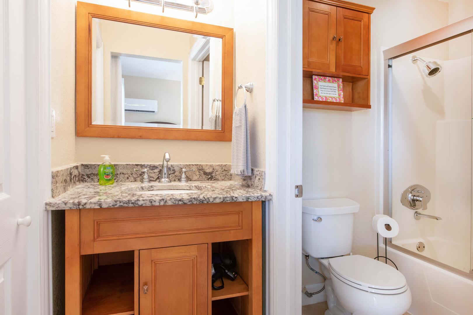 Guest ensuite with shower bath.