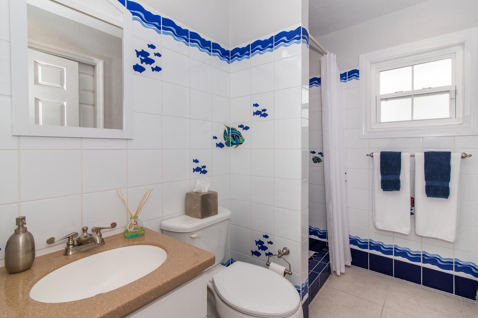 Both Guest Bedrooms share this full hall bath with shower.