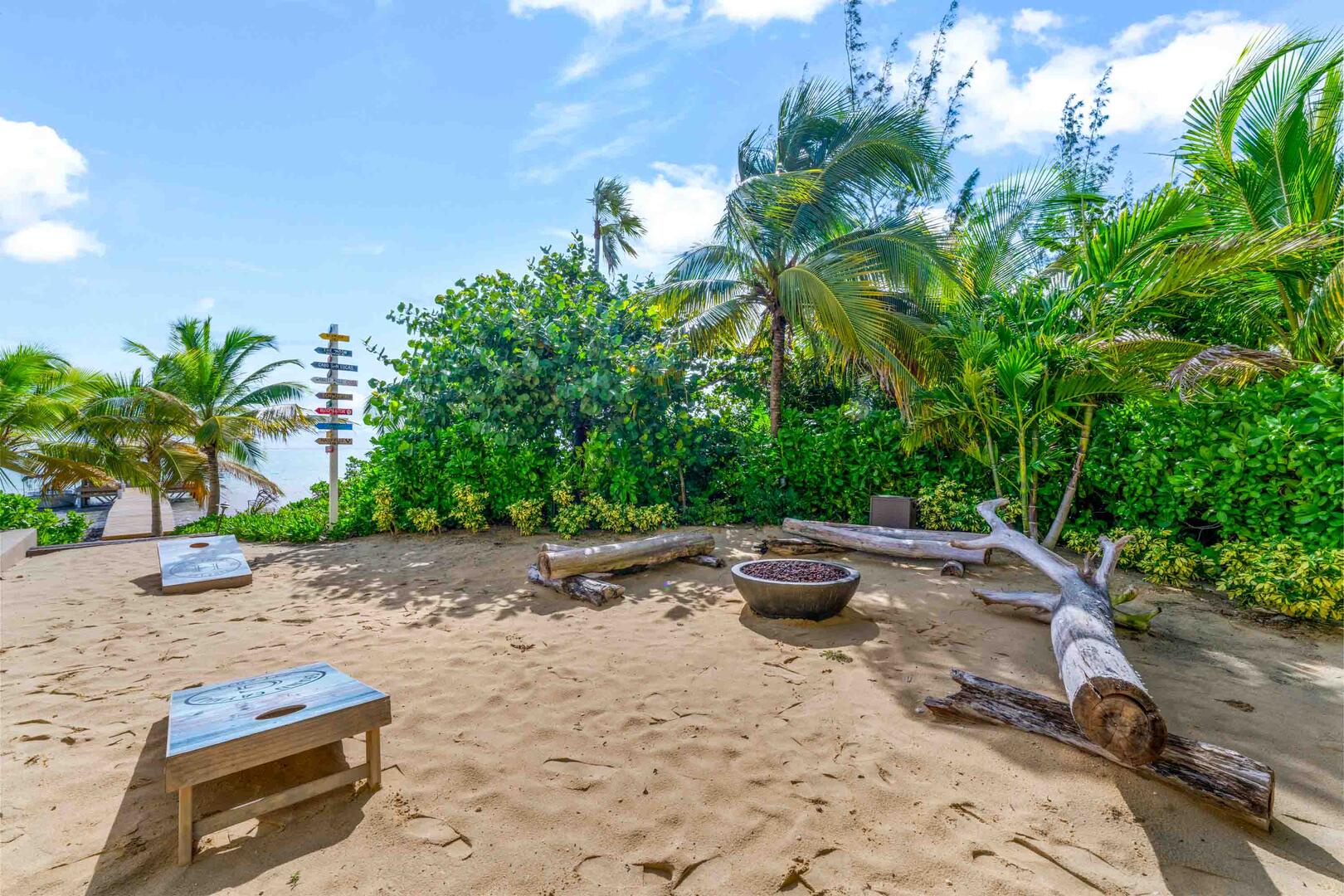 The backyard beach includes a corn hole set and a gas fire pit for late night hangs.