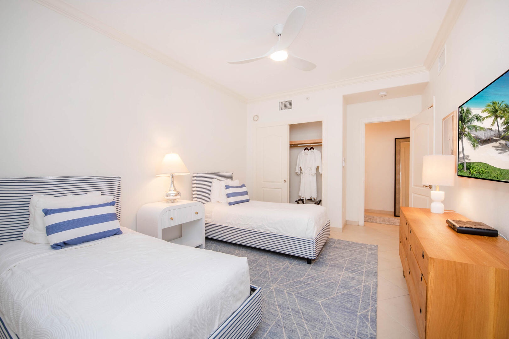 Bedroom 2 with two twin beds and cable HD TV. Twin beds can be fitted into a king upon request.