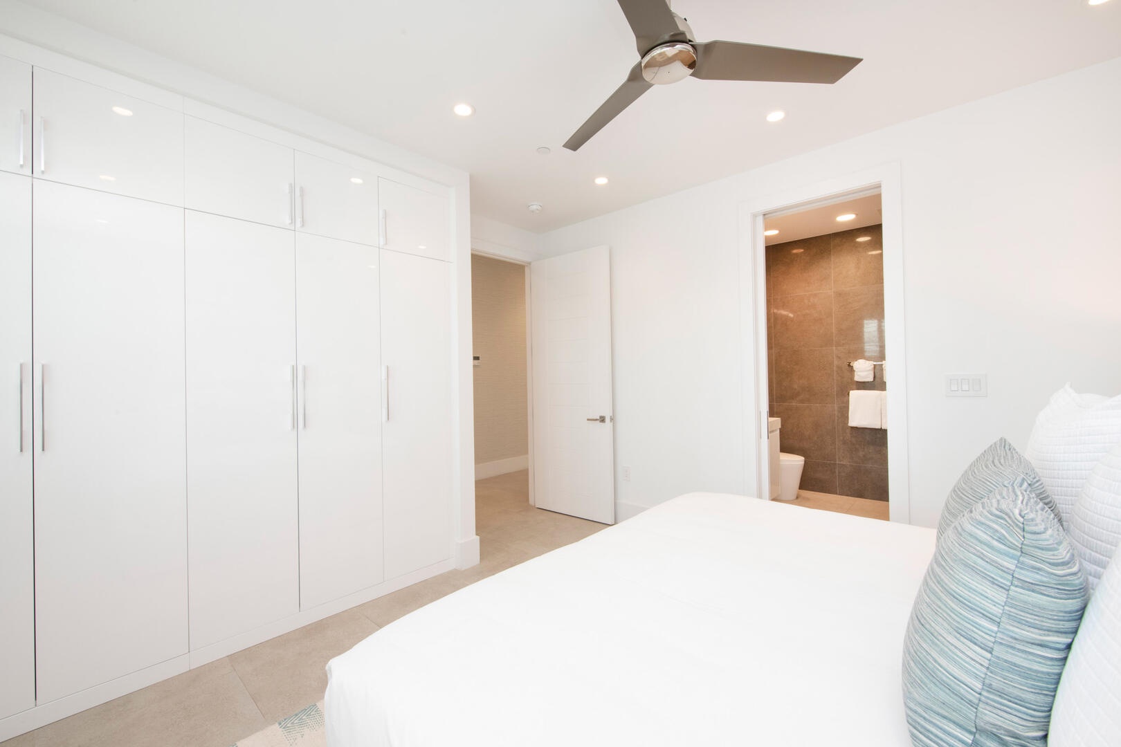 Guest Suite #2 with ample closet space and an ensuite bath.