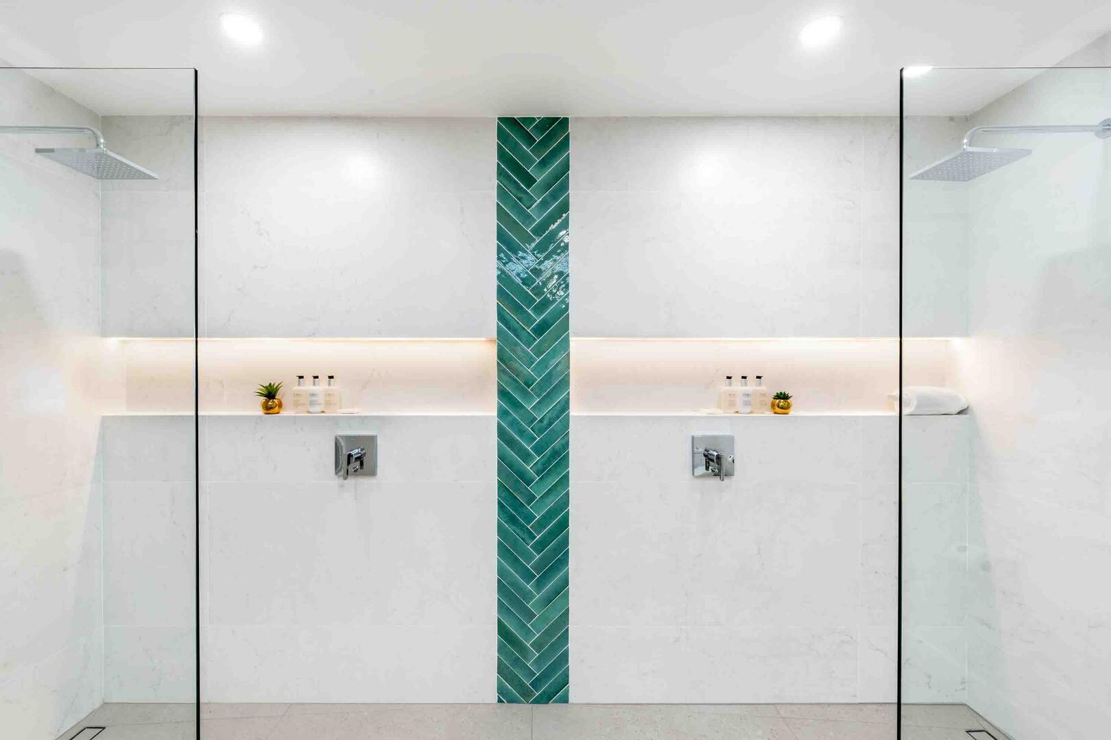 Spacious walk-in shower with dual shower heads.