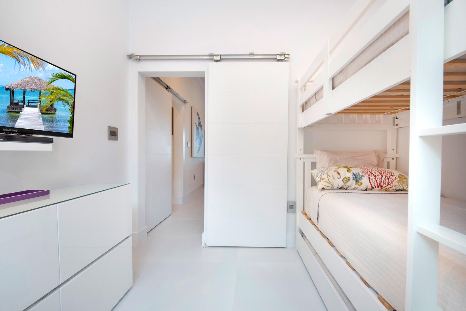 Bunkroom with twin-over-twin bunks with third twin trundle bed,