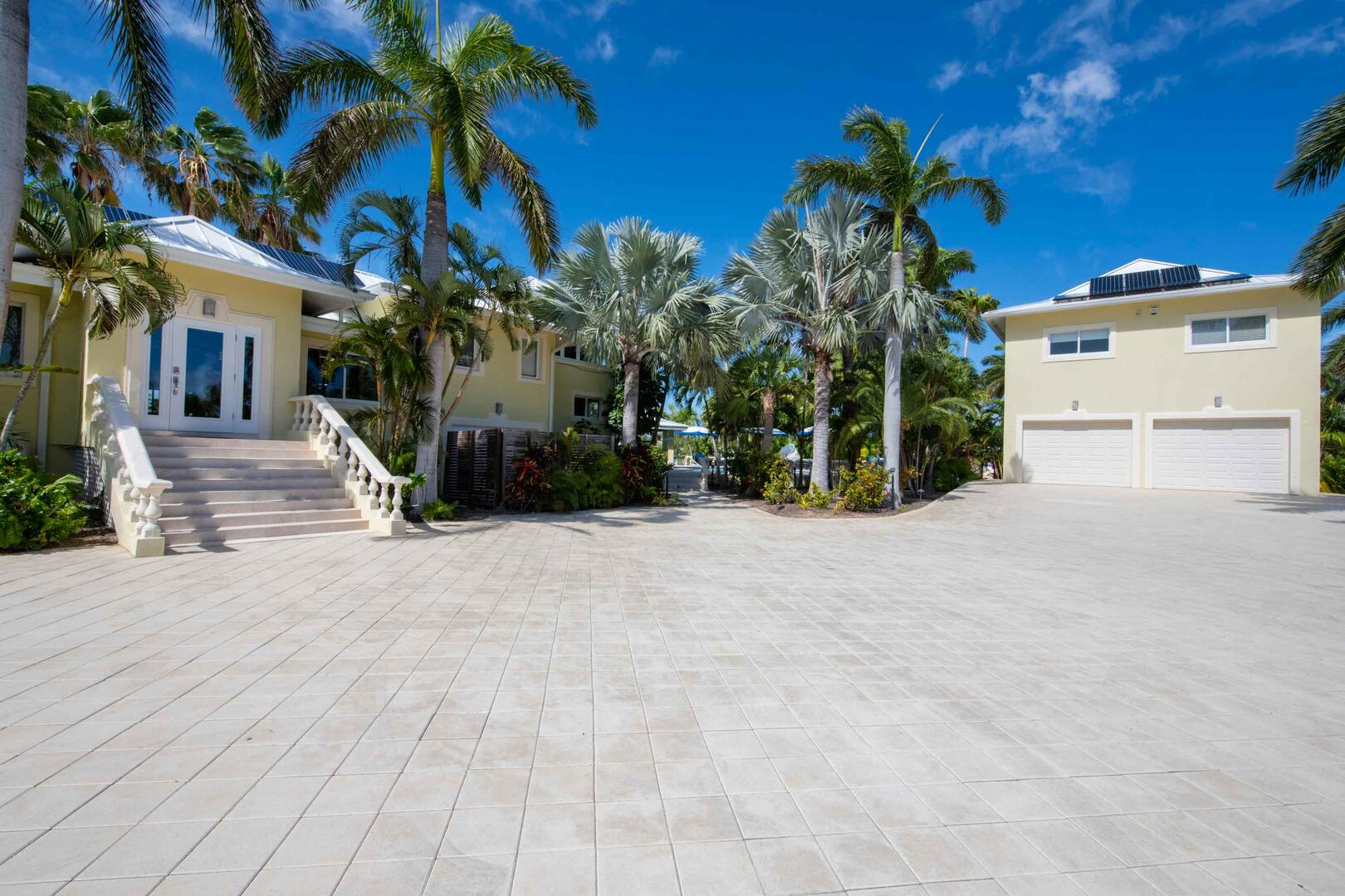 Large driveway with plenty of parking. The 2-bedroom Guest Suite is just above the garage detached from the main villa.