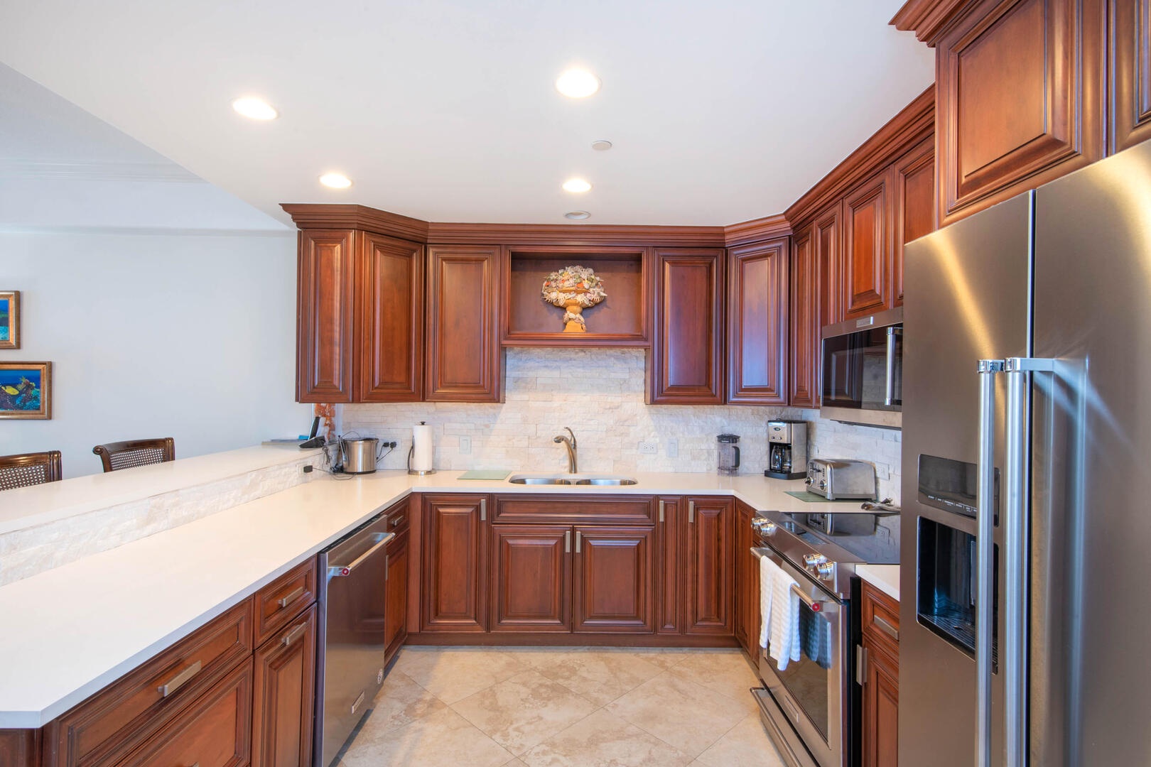 Kitchen with modern appliances plus a drip coffee maker and toaster.