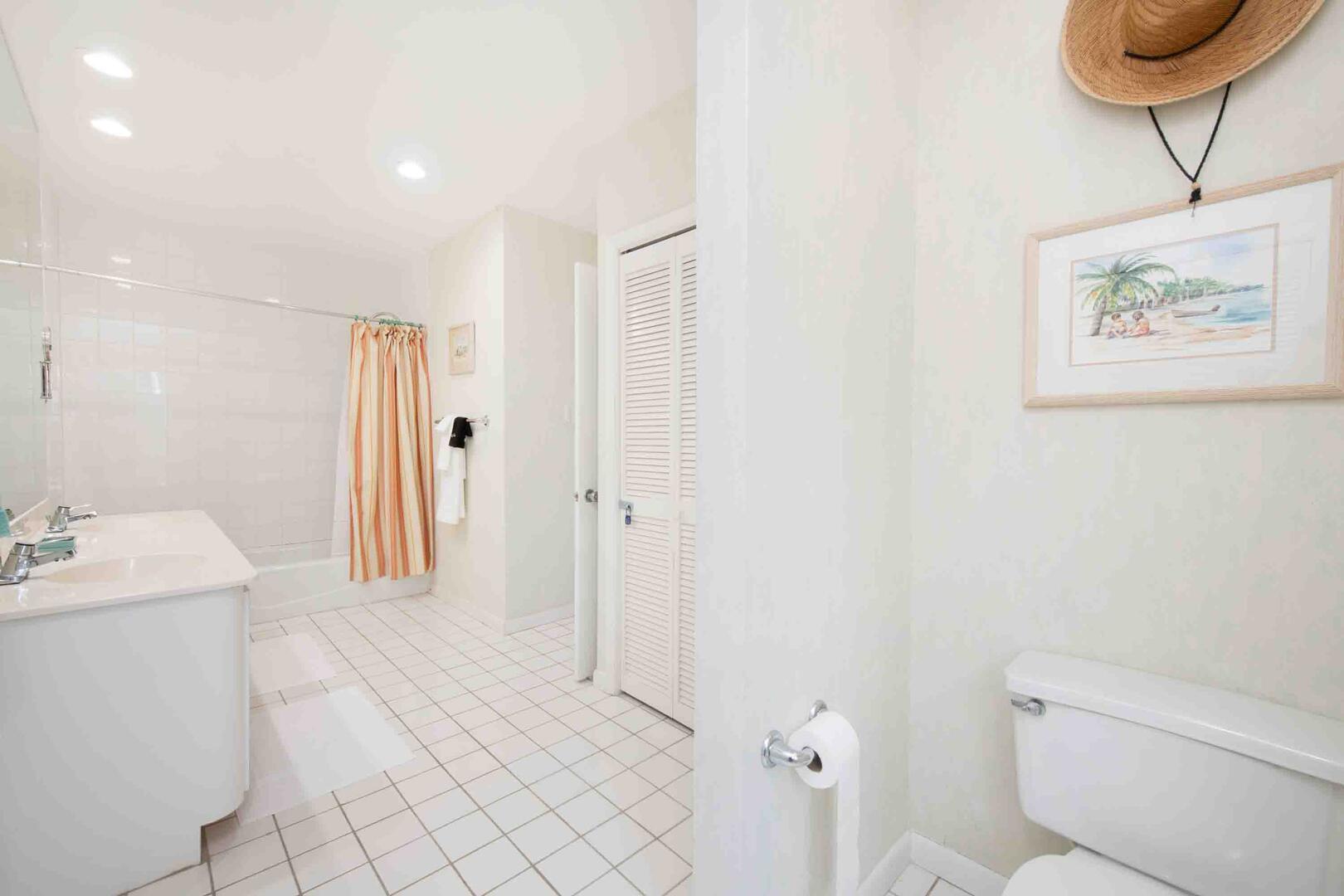 Bedroom 1 ensuite with dual vanity and a shower bath.