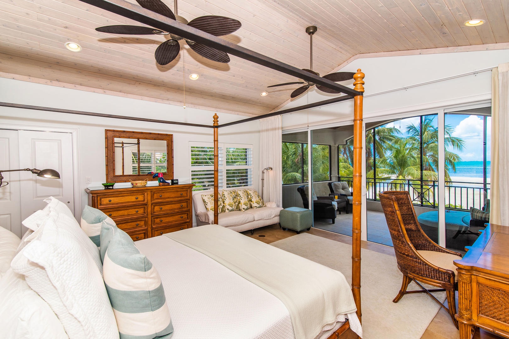 Master suite with king bed, ocean views, and private balcony.