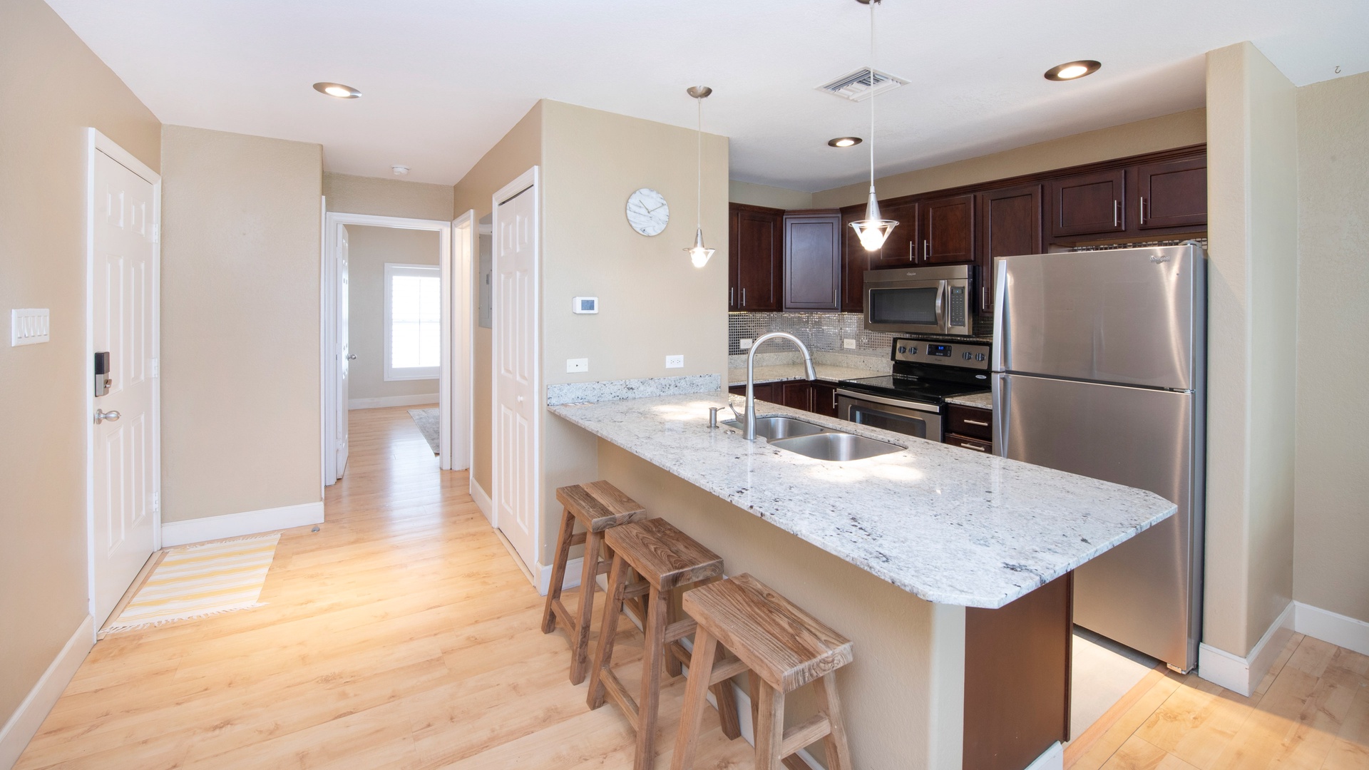 Kitchen with island and bar seating.
