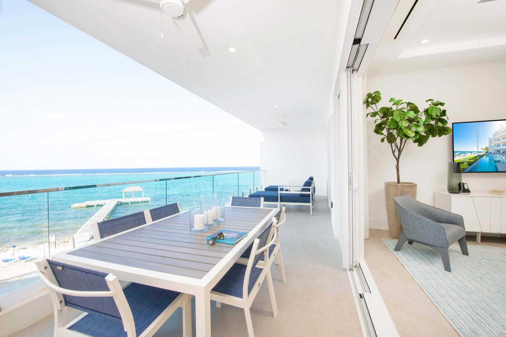 Walk out access to the ocean balcony from the living area. Enjoy a seaside meal with these sweeping views.