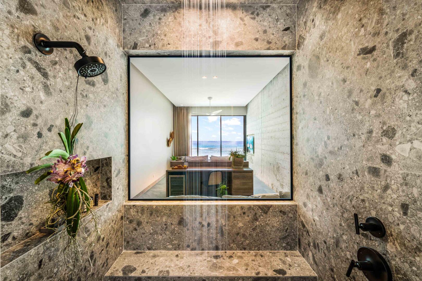 Suite 4 ensuite bathroom with double vanity, multiple mirrors, lighted make-up station, walk-in oceanview shower