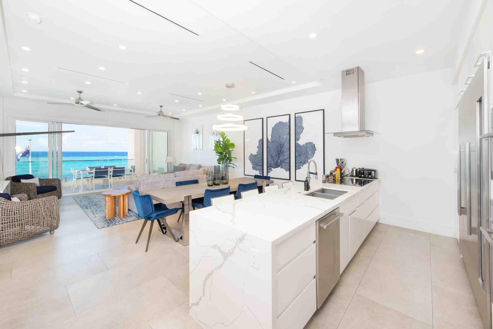 Open concept great room encompassing the living, dining, and kitchen areas. To keep things tidy, complimentary housekeeping is provided during your stay.