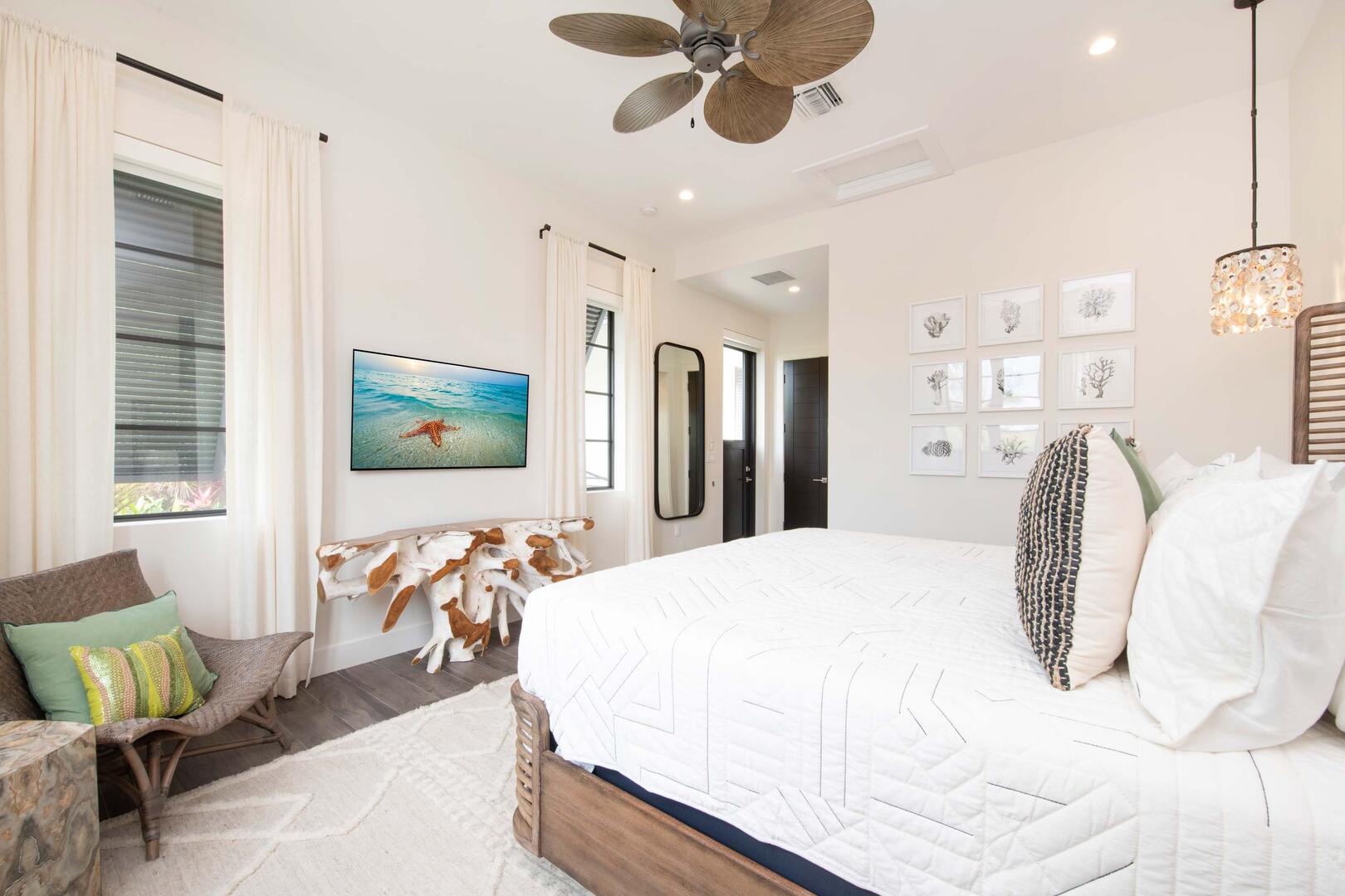 East Suite ? upper-level, king bed, oceanfront, vaulted ceilings, walk-out access to the oceanfront railed balcony, desk, double closets, SmartTV.