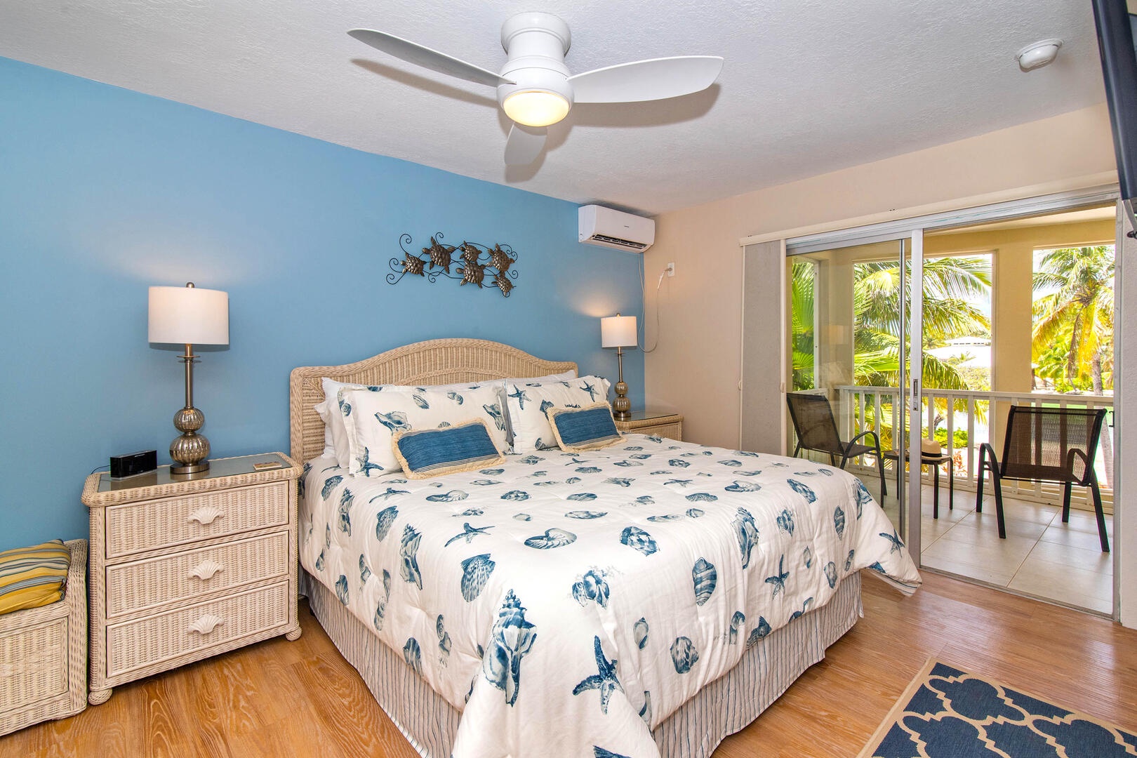 Bedroom 1 is the primary suite furnished with a king bed, cable television, and private balcony.