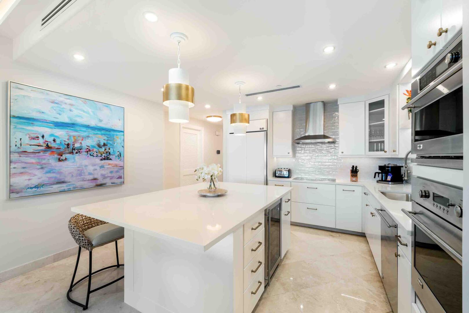 The kitchen comes equipped with an under counter wine cooler and a drip coffee maker.