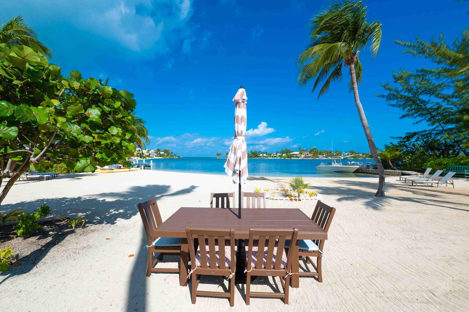 Outdoor dining table for meals right on the beach! The home comes with a propane grill for surf and turf cookouts.