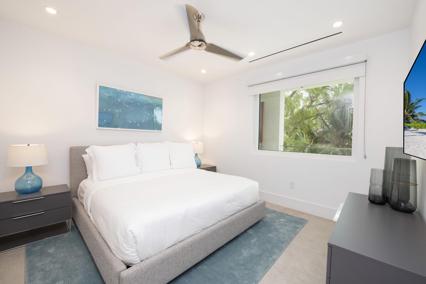 Guest Suite #1 with king bed and television.