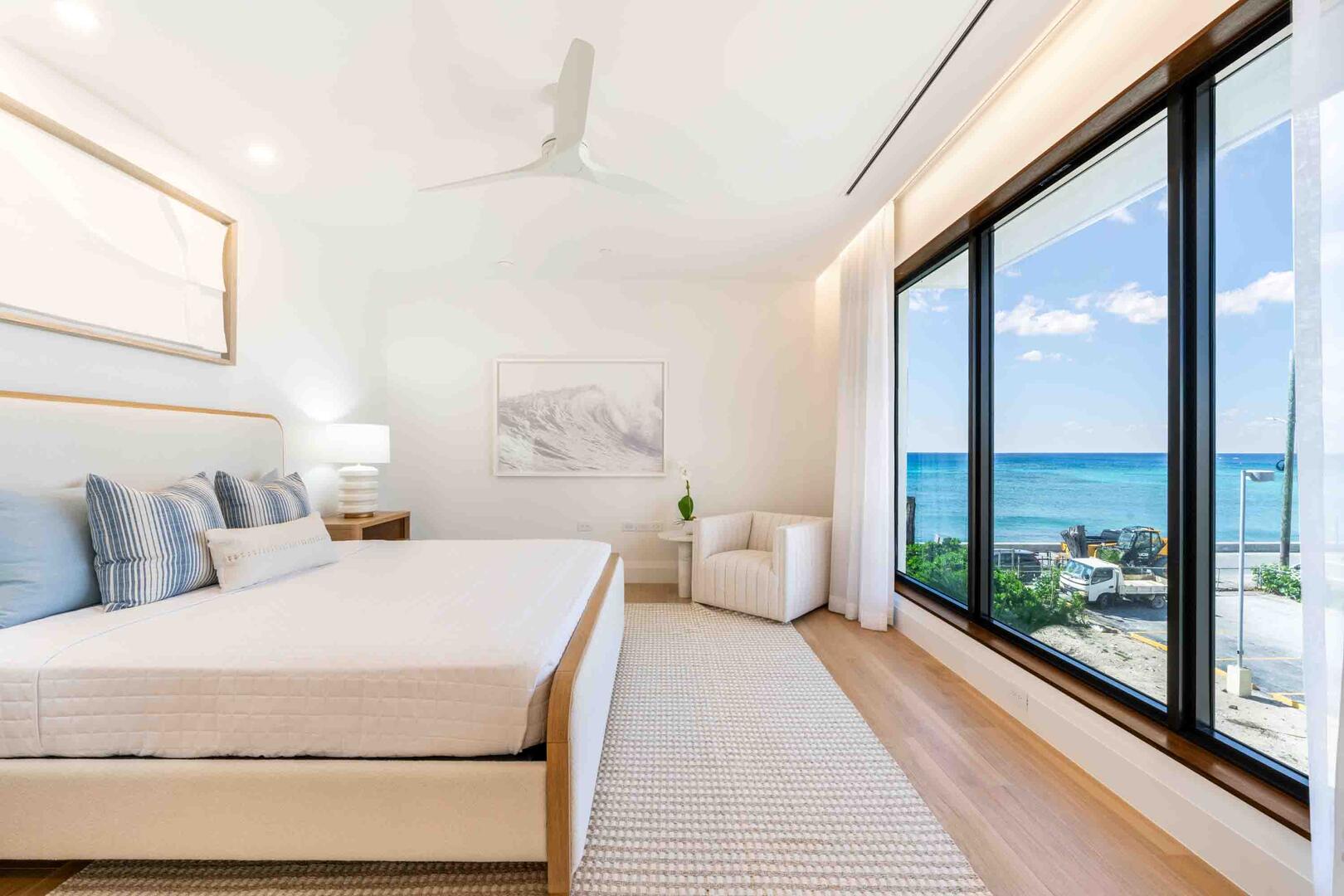 Bedroom 1 is the Primary Suite with a king bed, television, and ocean views.