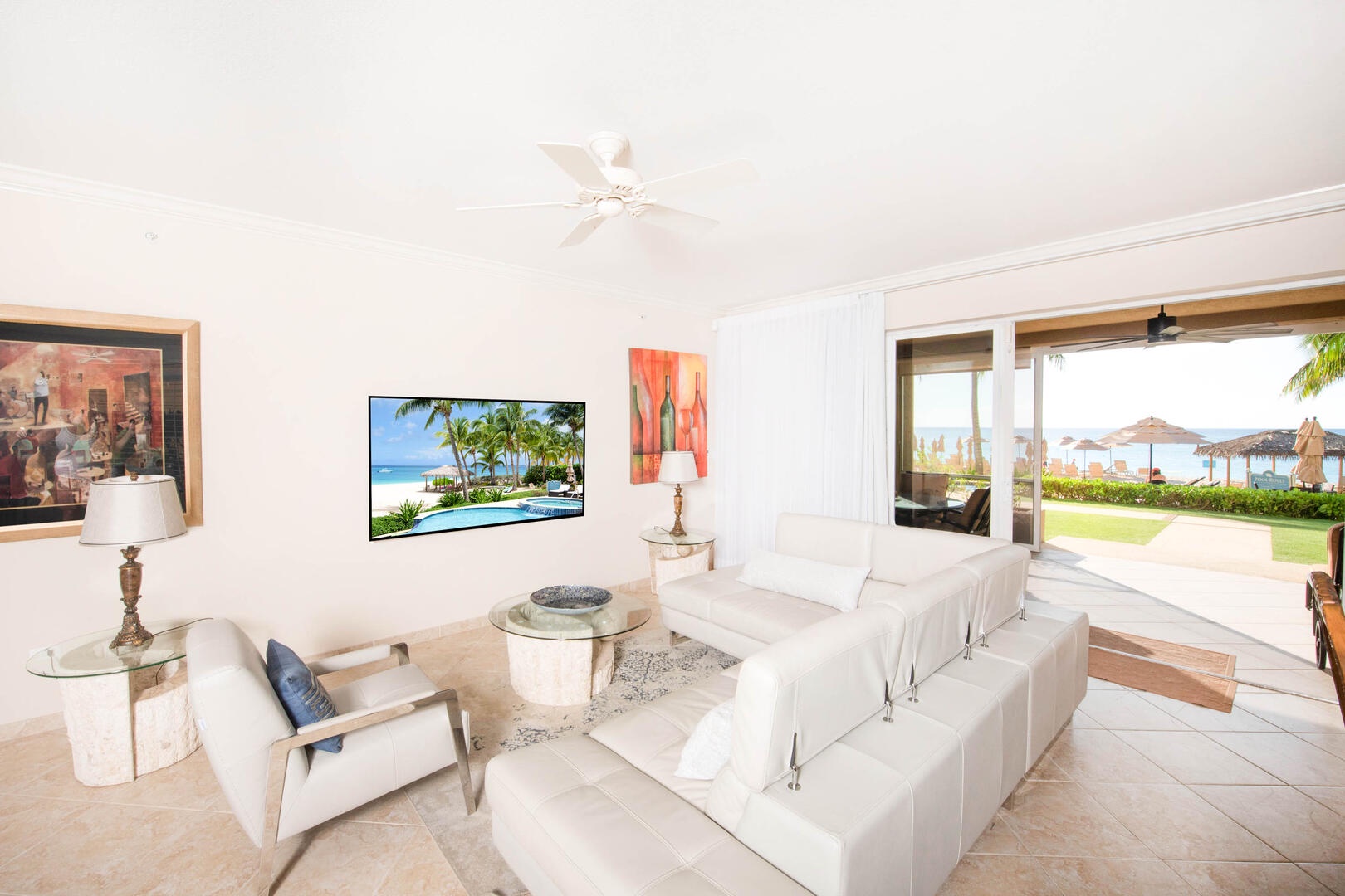 Living area with HD cable TV, and walkout access to the screened patio.