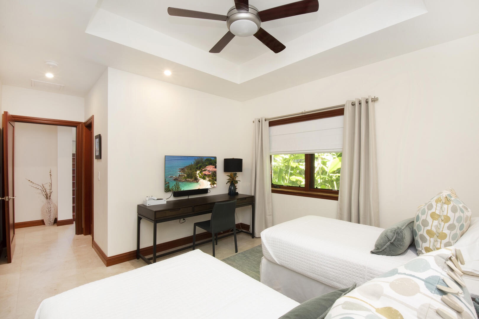 The Twin Suite comes furnished with 2 twin beds and a television with Xbox One
