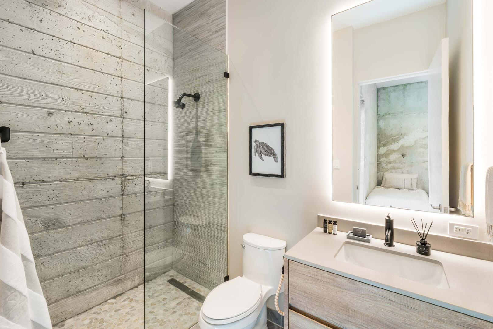 Suite 5 ensuite bathroom with walk-in shower, and single vanity