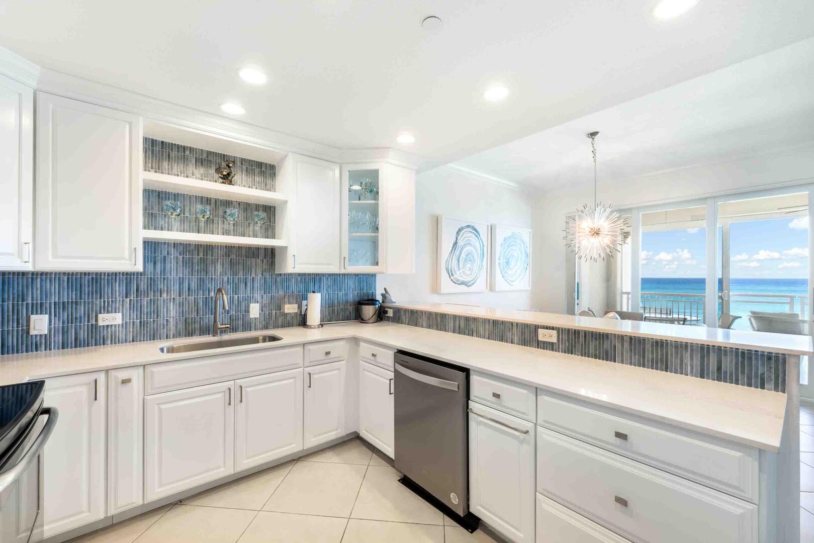 The kitchen comes stocked with dishware, cookware, glassware, and cutlery.