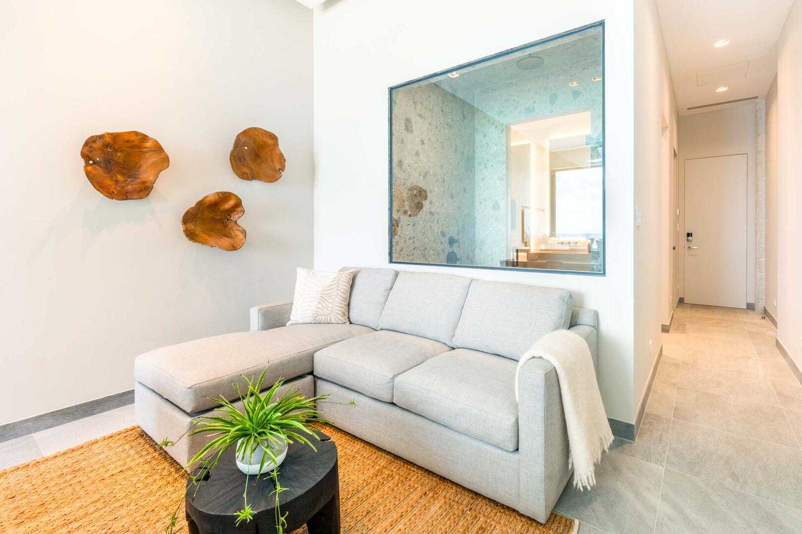 Oceanfront king suite 2 - king platform bed, desk, oceanfront floor-to-ceiling glass doors, 65" TV w/swivel mount, beverage fridge, coffee center, upholstered chair, sofa