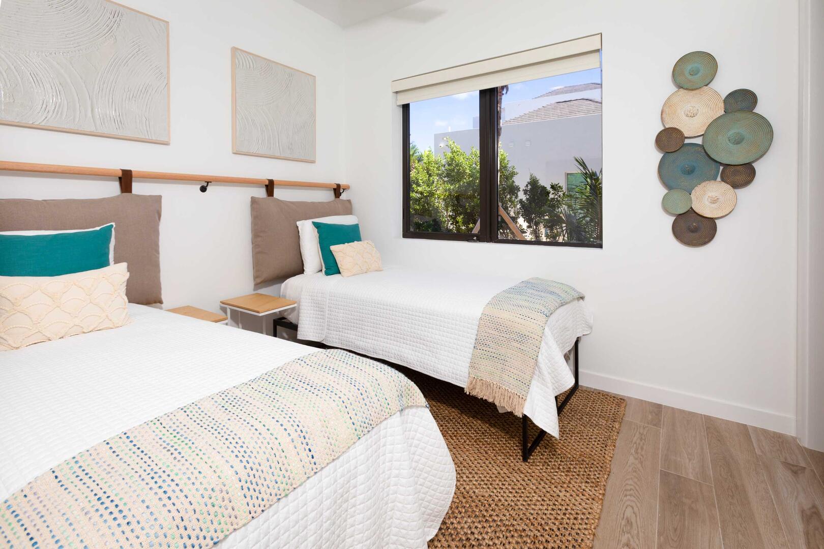 Twin Suite with two twin beds and island views.