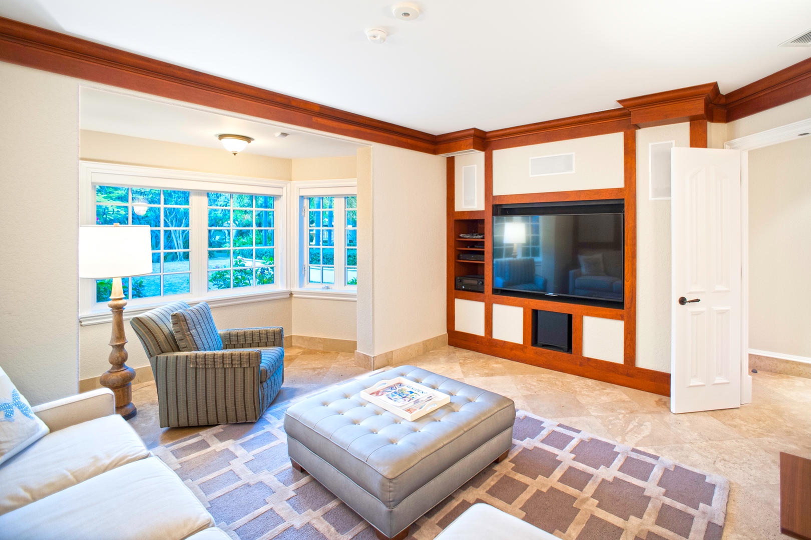 The second media room offers garden views and comfy furniture making it perfect for a movie night.