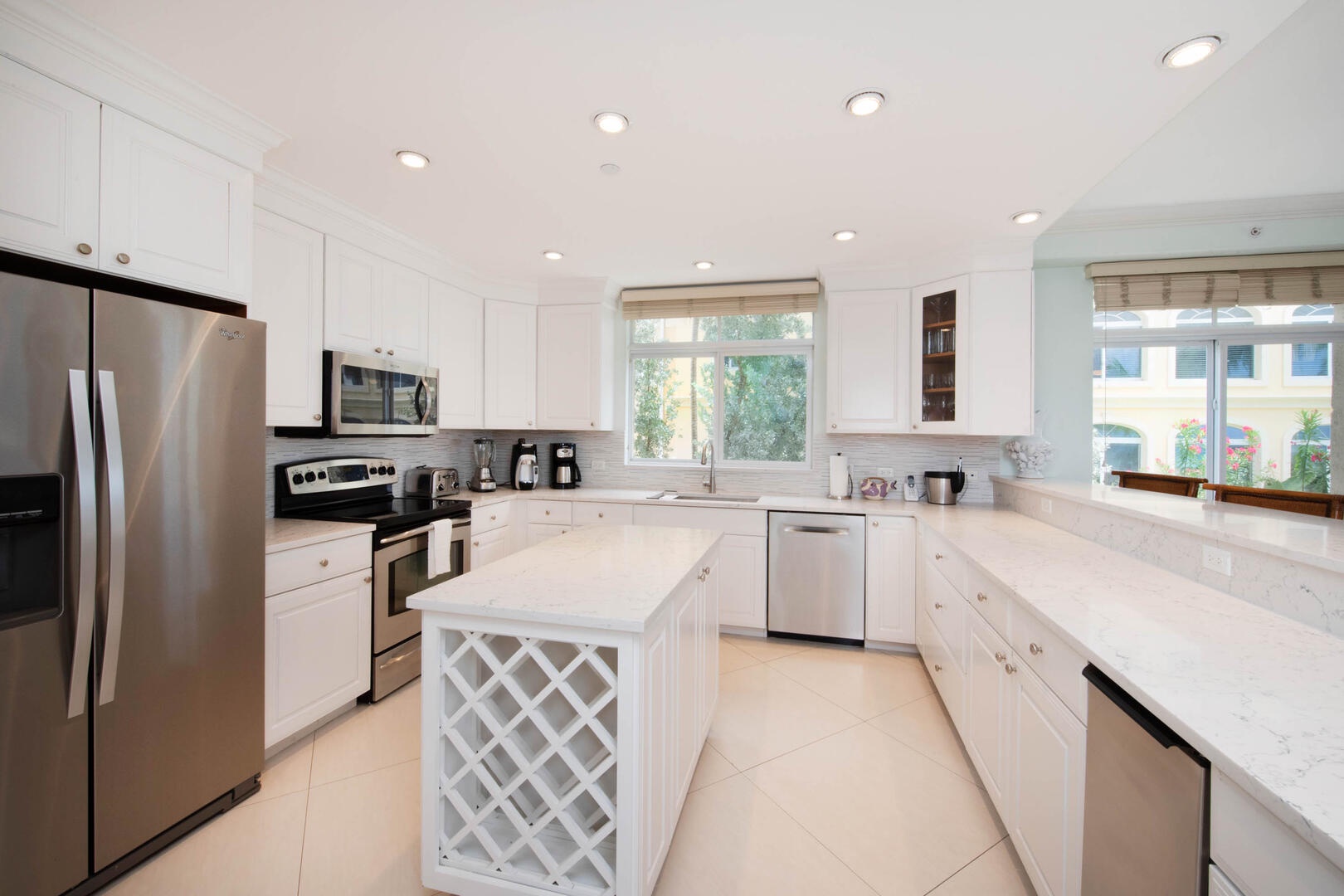 The kitchen comes stocked with dishware, cookware, glassware, and cutlery.