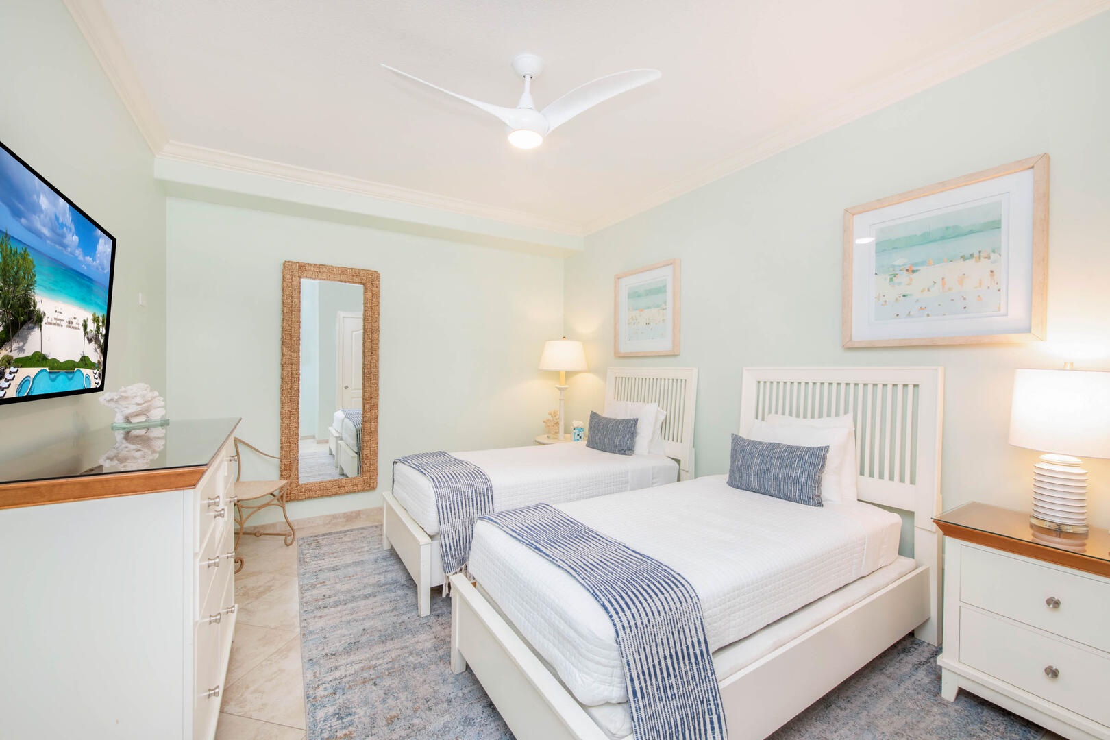 Bedroom 2 with two twin beds and cable HD TV.