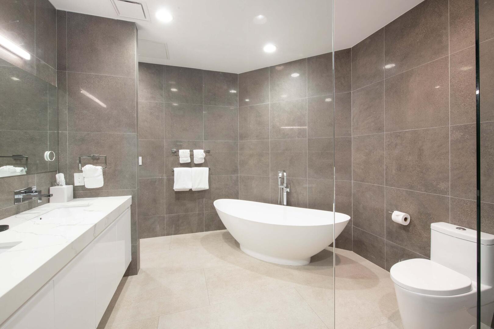 Primary Ensuite with dual vanities, soaking tub, and walk-in shower.