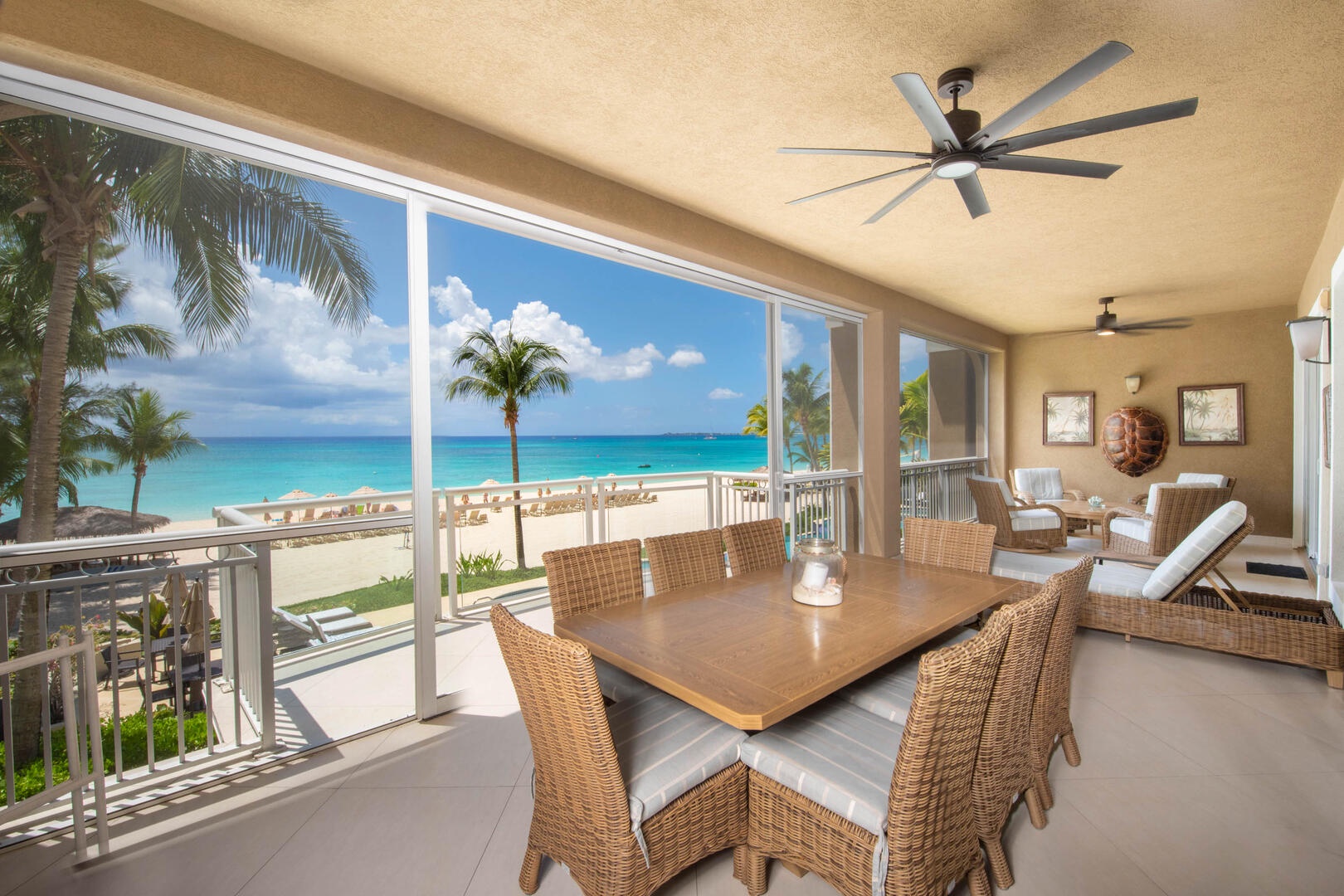 Furnished balcony with outdoor dining table plus lounge seating.