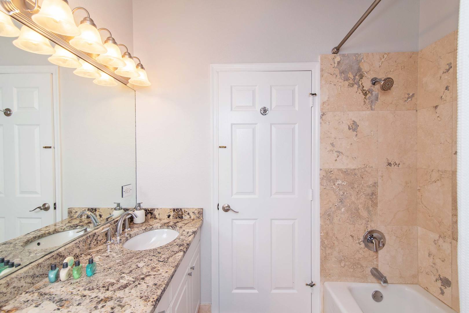 Shared hall bath on the upper level with shower bath.