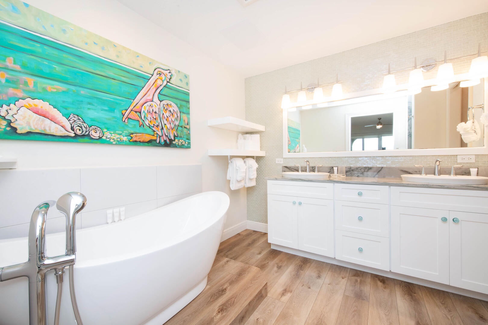 Primary ensuite with dual vanity and soaking tub.