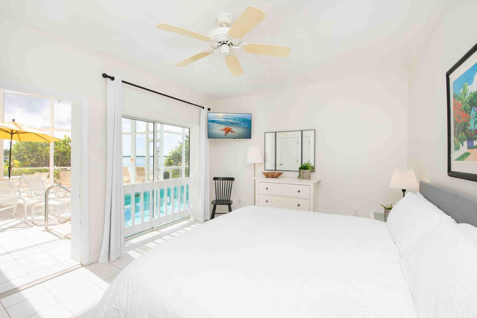 The lower level guest suite enjoys walkout access to the pool deck.