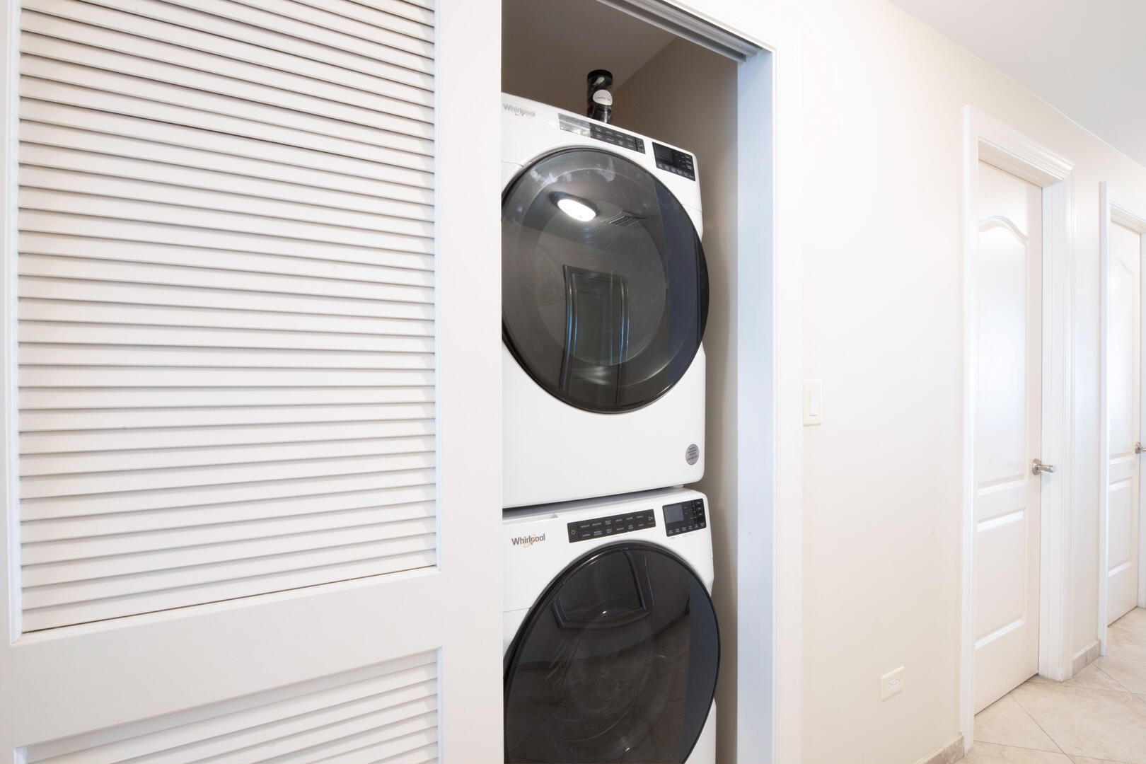 In-unit washer and dryer just off the hallway.
