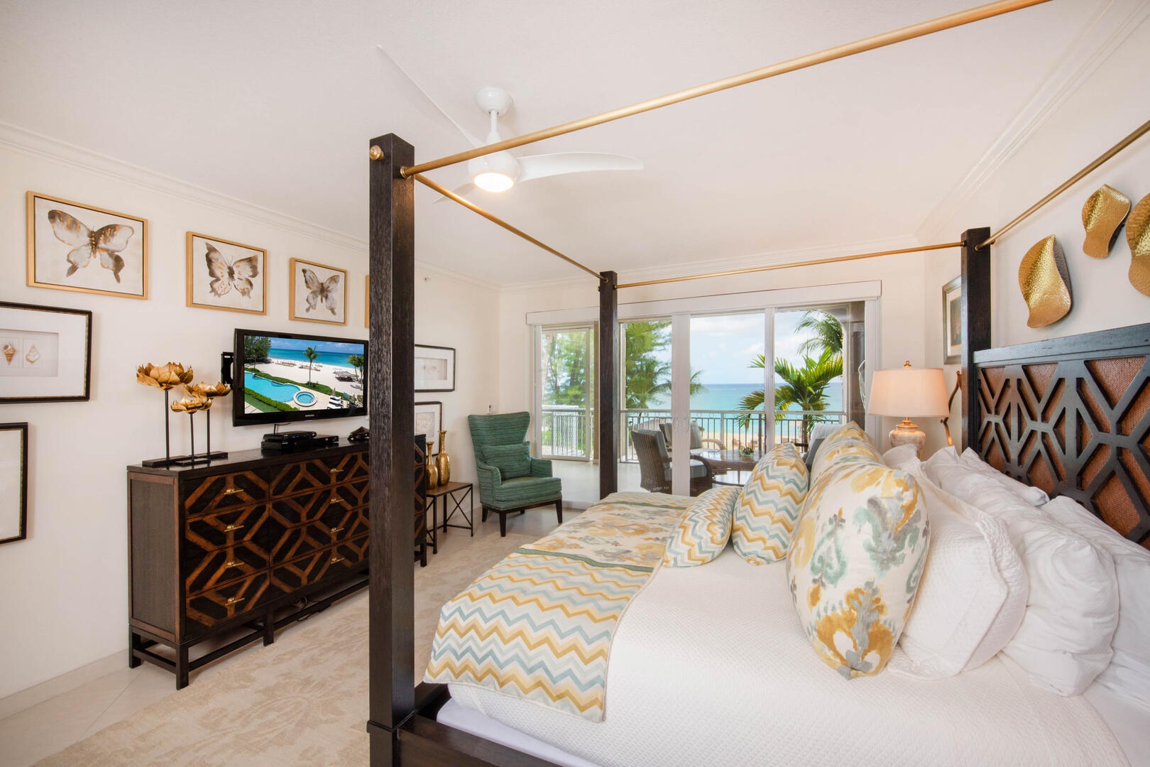 Primary suite with king bed, HD cable television, and walkout access to the screened balcony.