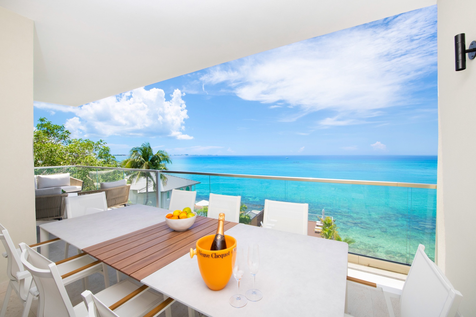 Balcony dining table for alfresco meals with spectacular ocean views.