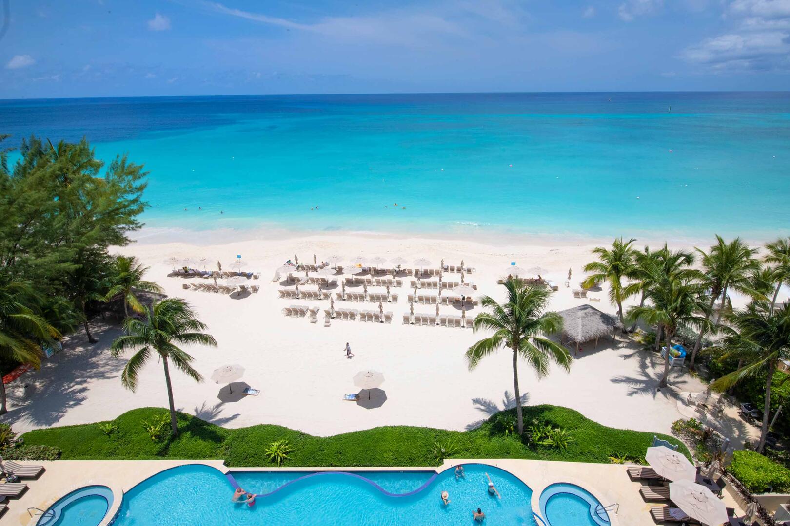 Balcony views of the resort's pool, heated spas, and dreamy beachfront.