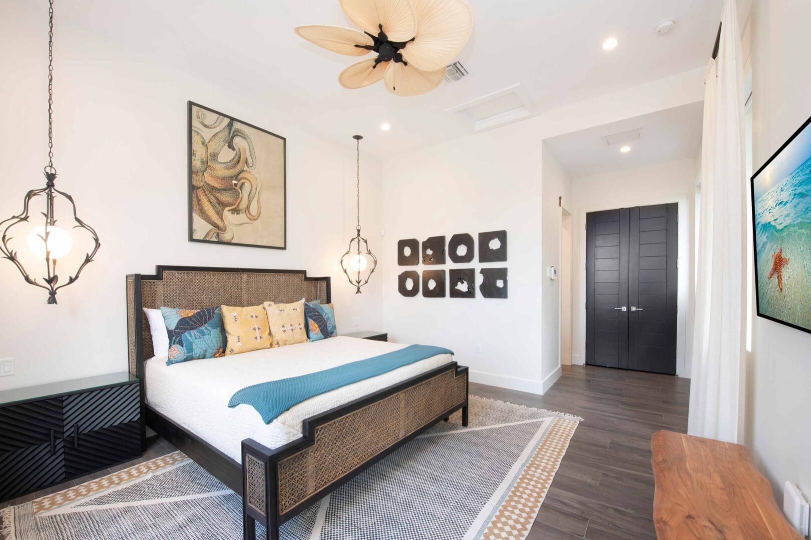 West Suite ? upper-level, king bed, oceanfront, vaulted ceilings, walk-out access to the oceanfront railed balcony, desk, double closets, SmartTV.