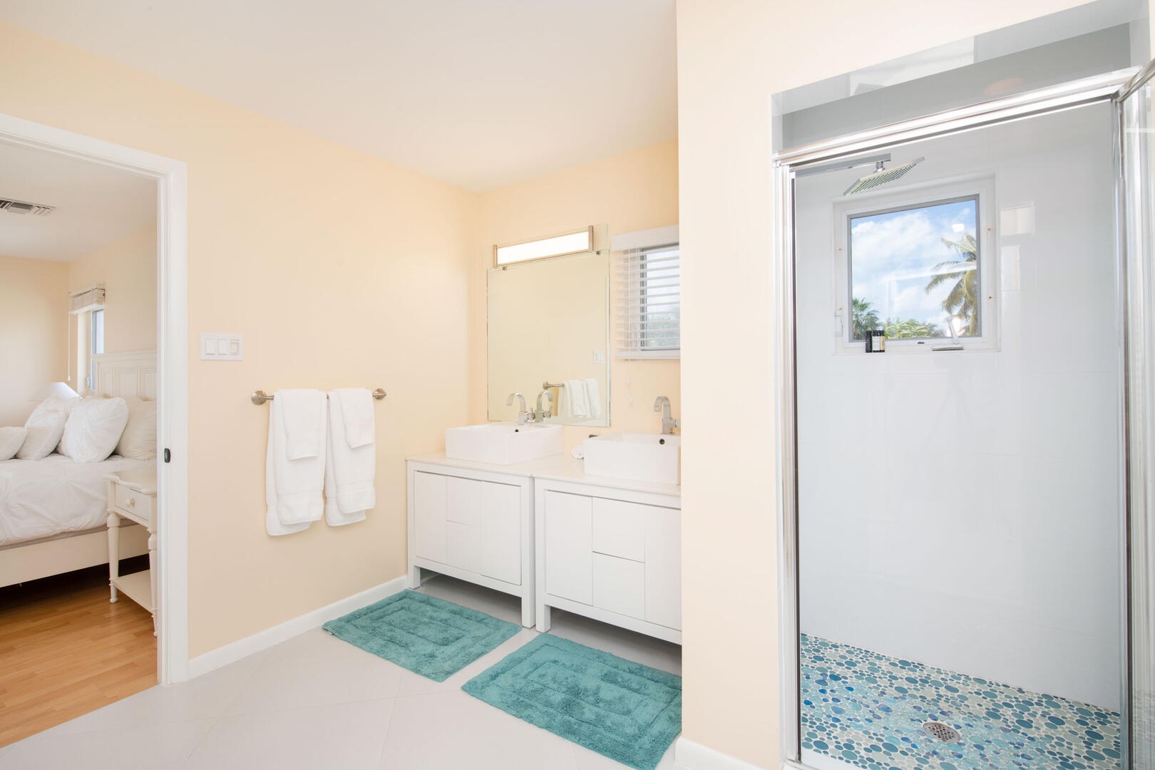 Primary ensuite with dual vanity and shower.