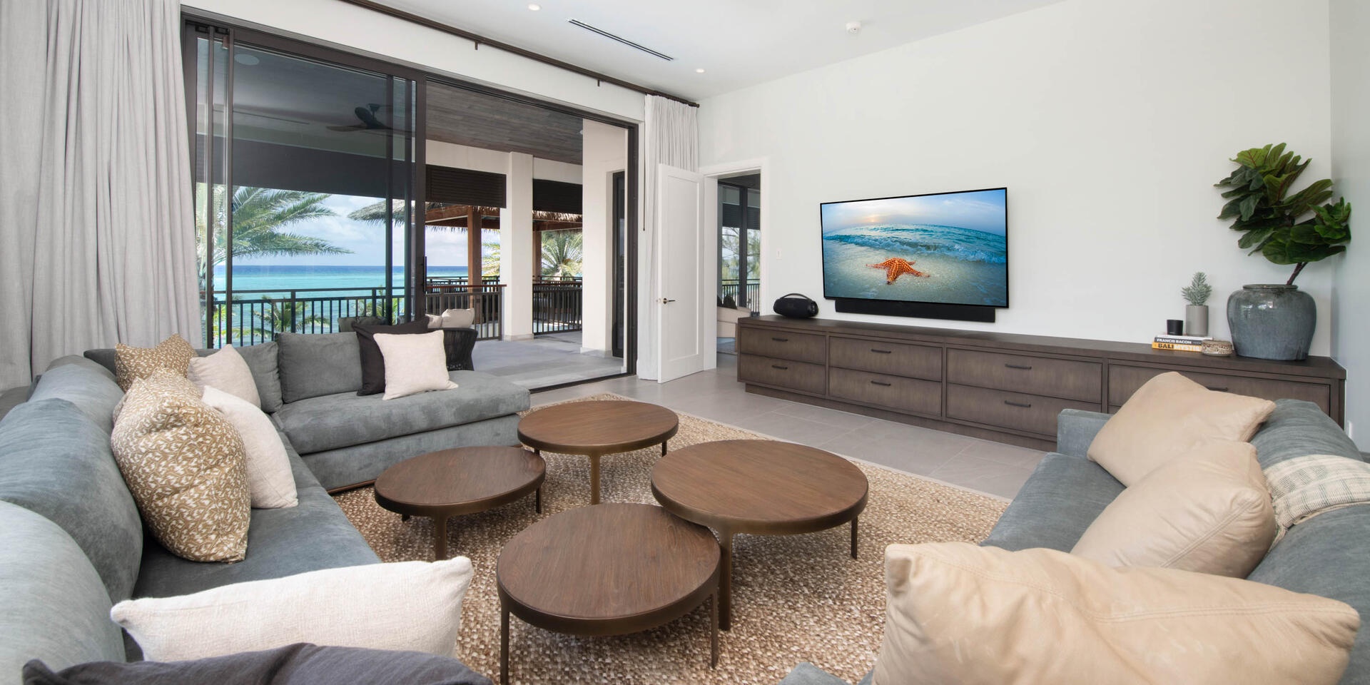 Adult's media den with SmartTV, sound bar, plus walkout access to the veranda balcony and birdcage lounge.