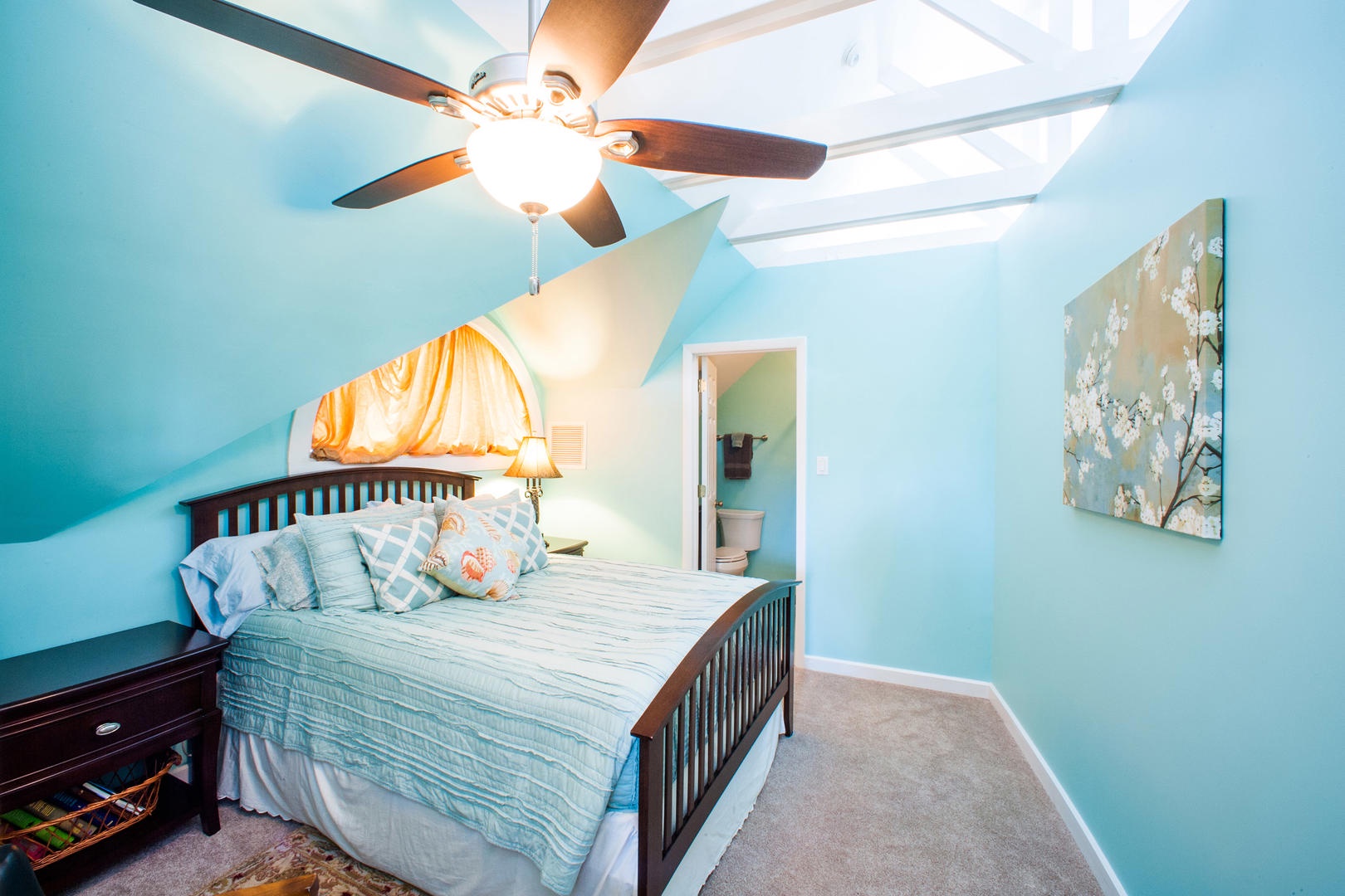 Bedroom 3 on the upper level with queen bed and ensuite with shower.