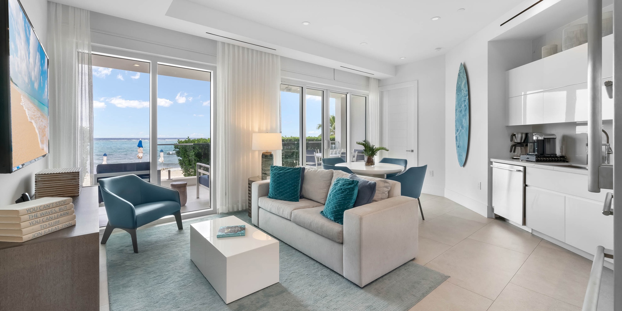 1 of 2 living areas with modern furnishings and designer decor.